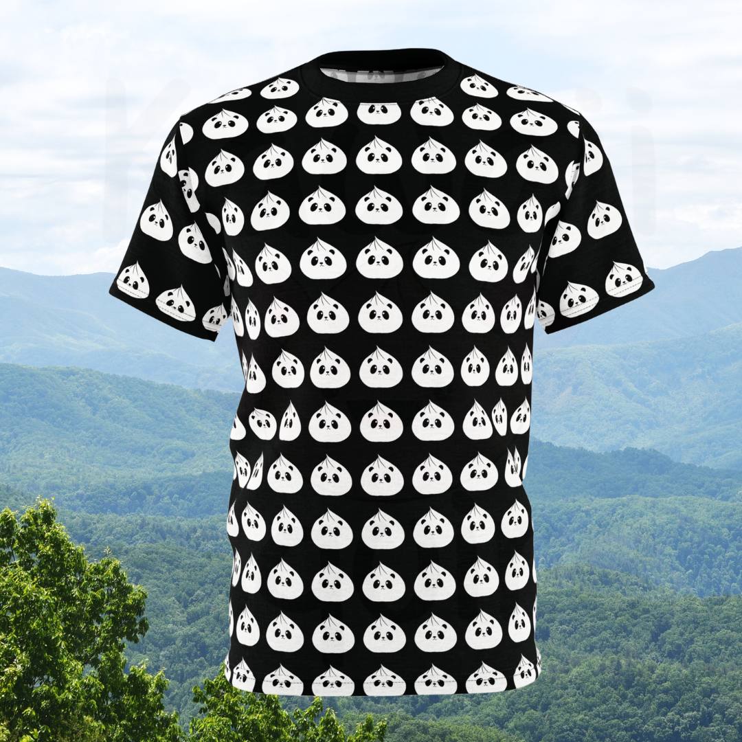 The image shows a black t-shirt featuring an all-over print design of white panda dumplings. The panda dumplings are arranged in a consistent, repeating pattern covering the entire shirt, including the sleeves.