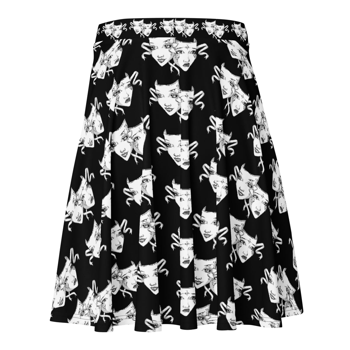 Straight-on view of skater skirt with high-contrast black background and repeating hand-drawn theatrical masks in white. Flowy cut and expressive drama faces make it a bold statement piece.