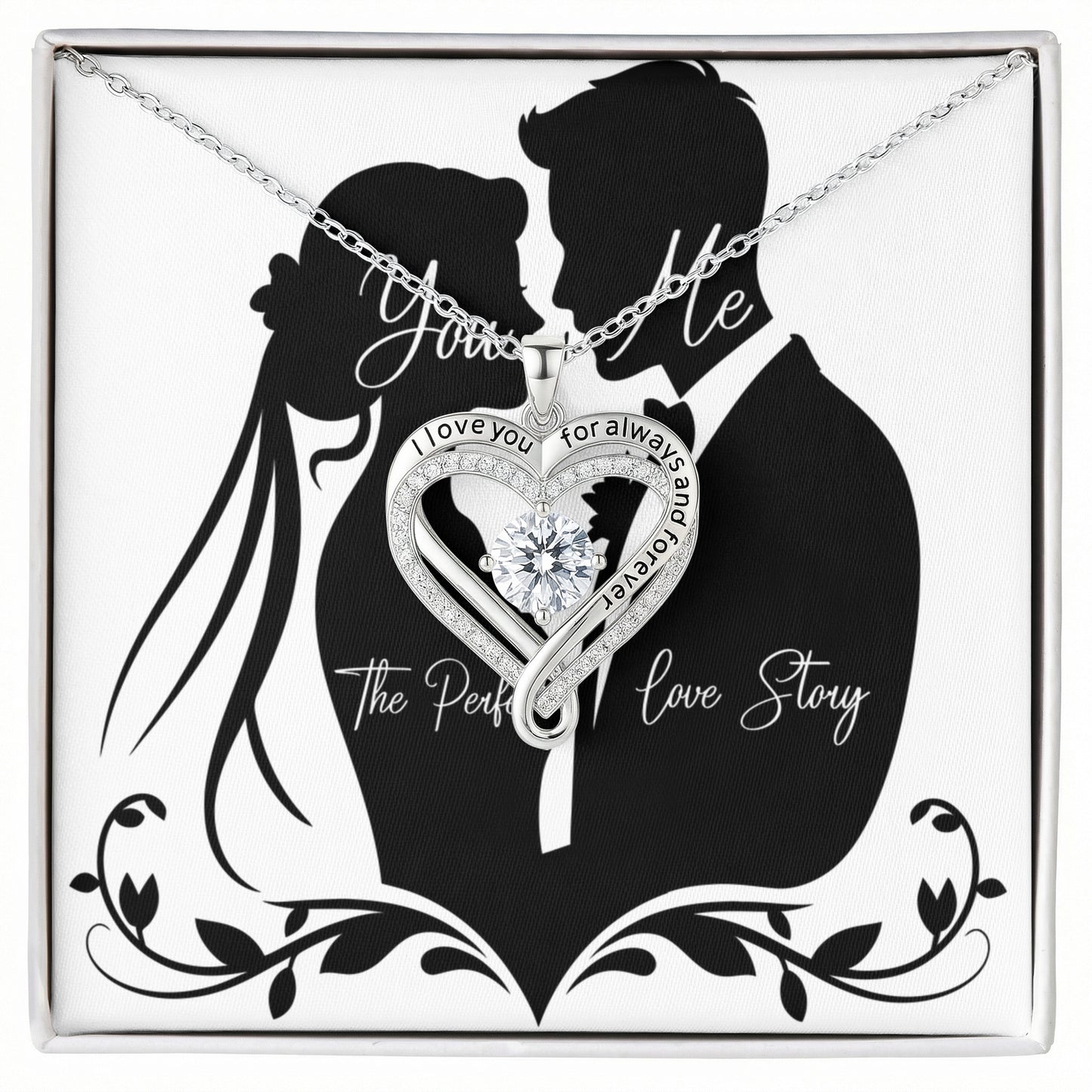 Love You Always Necklace featuring a heart-shaped pendant with a cubic zirconia center and engraved message, presented in an elegant box with a couple silhouette background.