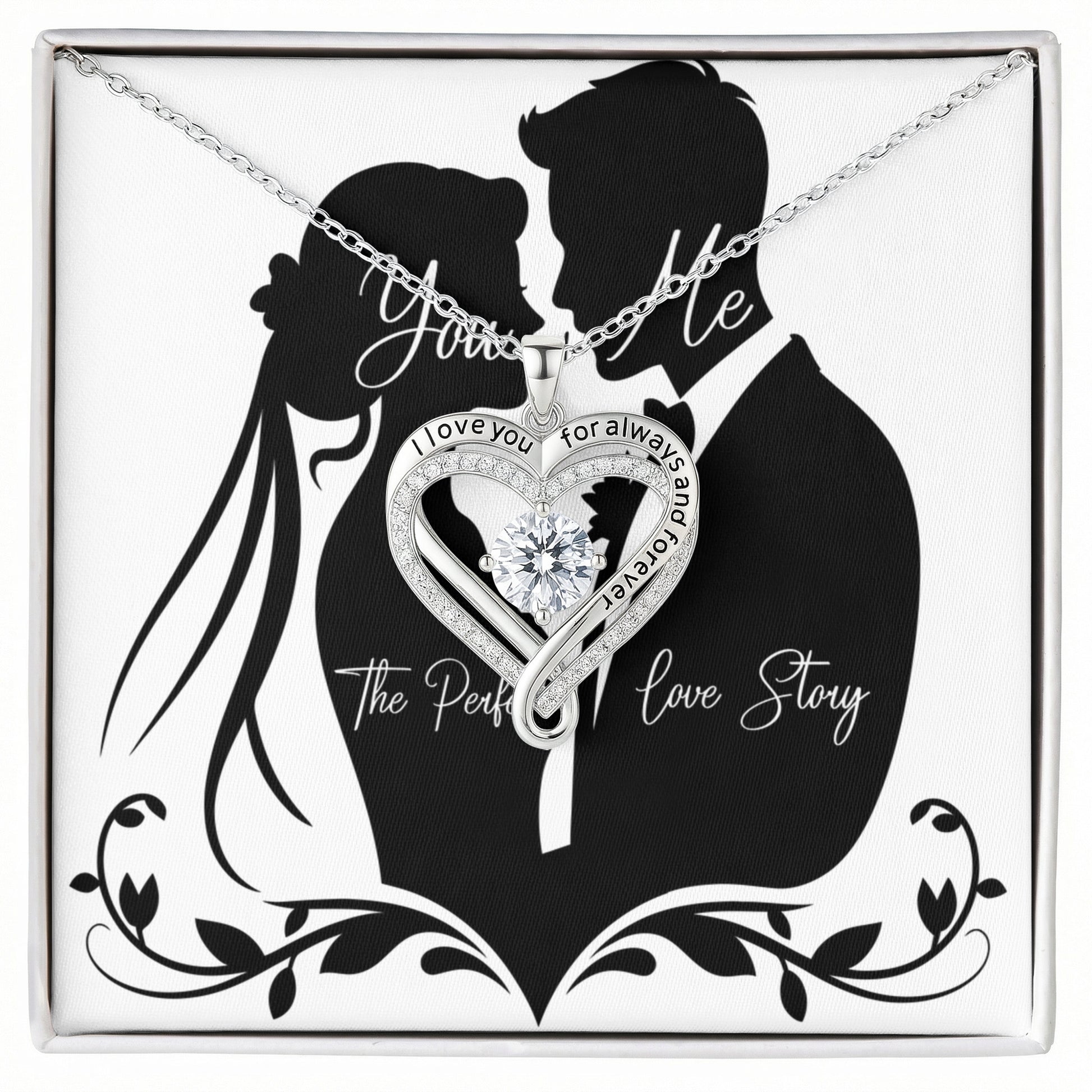 Love You Always Necklace featuring a heart-shaped pendant with a cubic zirconia center and engraved message, presented in an elegant box with a couple silhouette background.