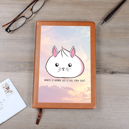 Cute bunny journal with pastel sky background and the phrase 'Write it down, let it go, stay soft', vegan leather lined notebook for self care and mental health.