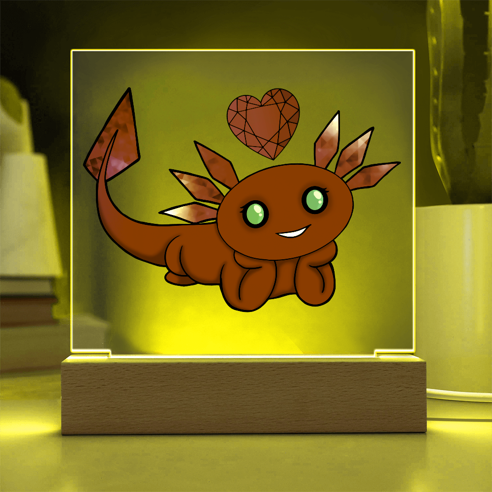 Red axolotl birthstone acrylic LED light illuminated with yellow
 lighting