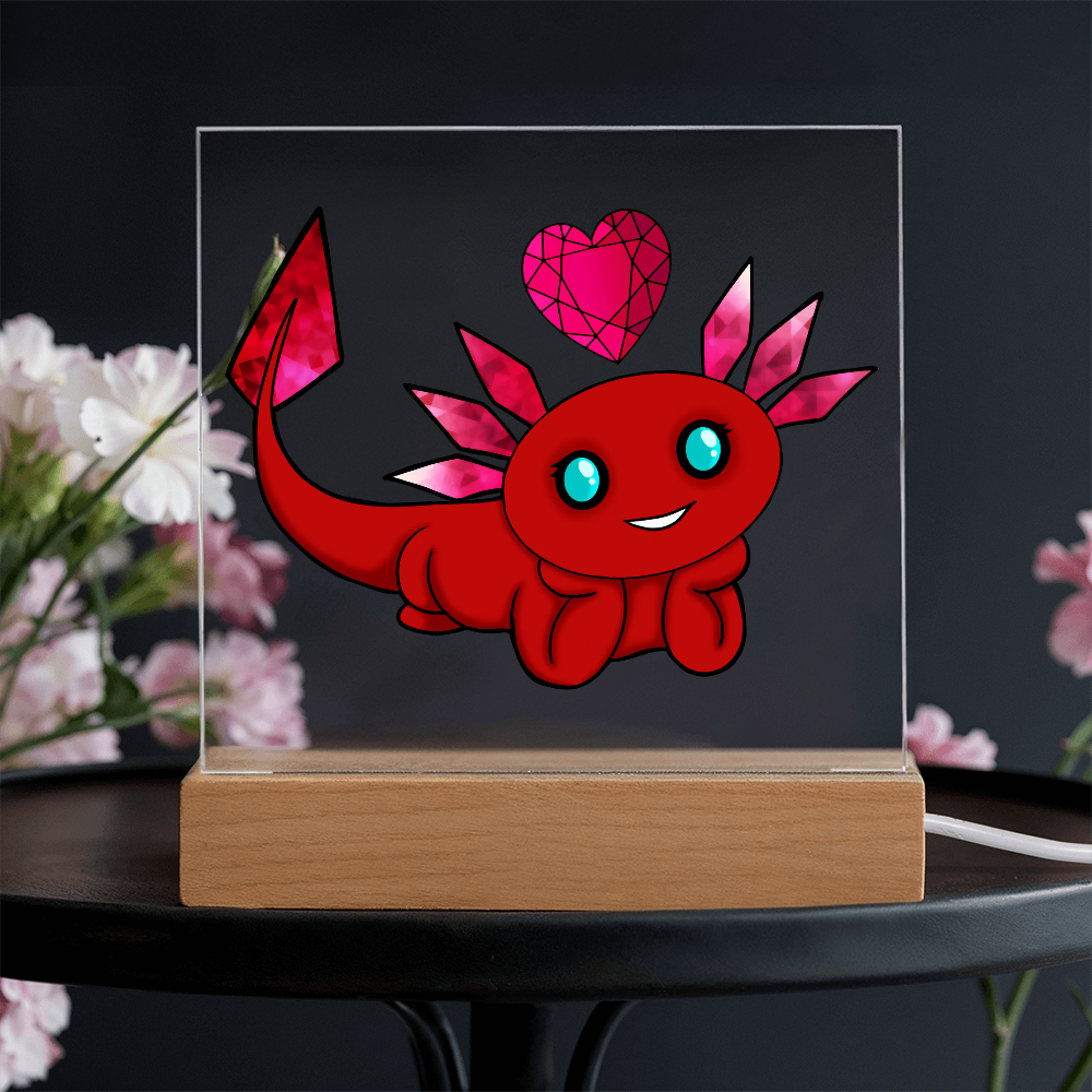 Red axolotl and gemstone heart acrylic plaque displayed against a dark floral background