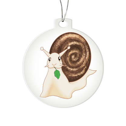 Snail ornament with a smiling snail design, holding a leaf, framed in a clear acrylic disc.