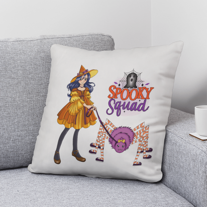 Cute Halloween decorative pillow featuring a witch walking a fluffy purple spider with the words "Spooky Squad" on a soft white double-sided throw pillow.