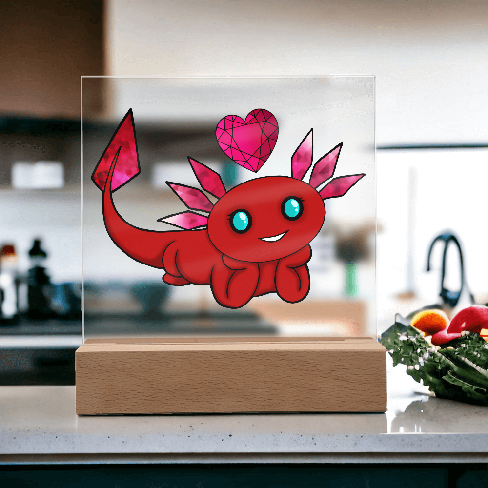 Cute red January birthstone axolotl acrylic plaque with gemstone gills on a wooden LED base