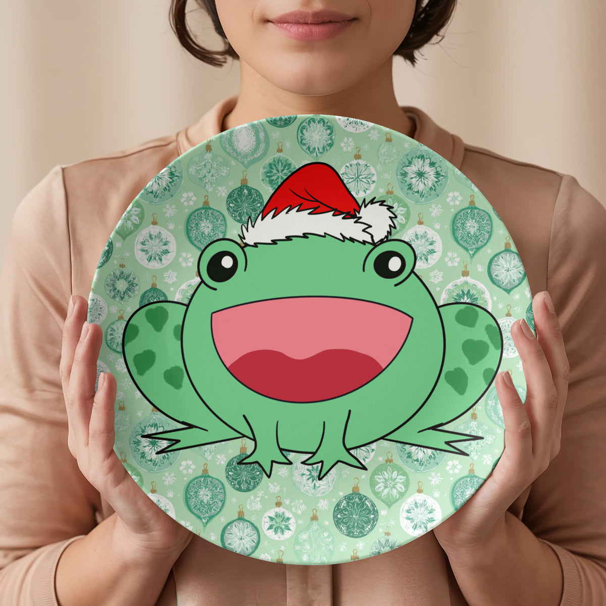 Person holding 10 inch Christmas frog plate