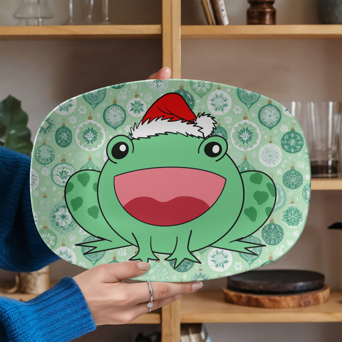 Person holding Christmas frog holiday serving platter
